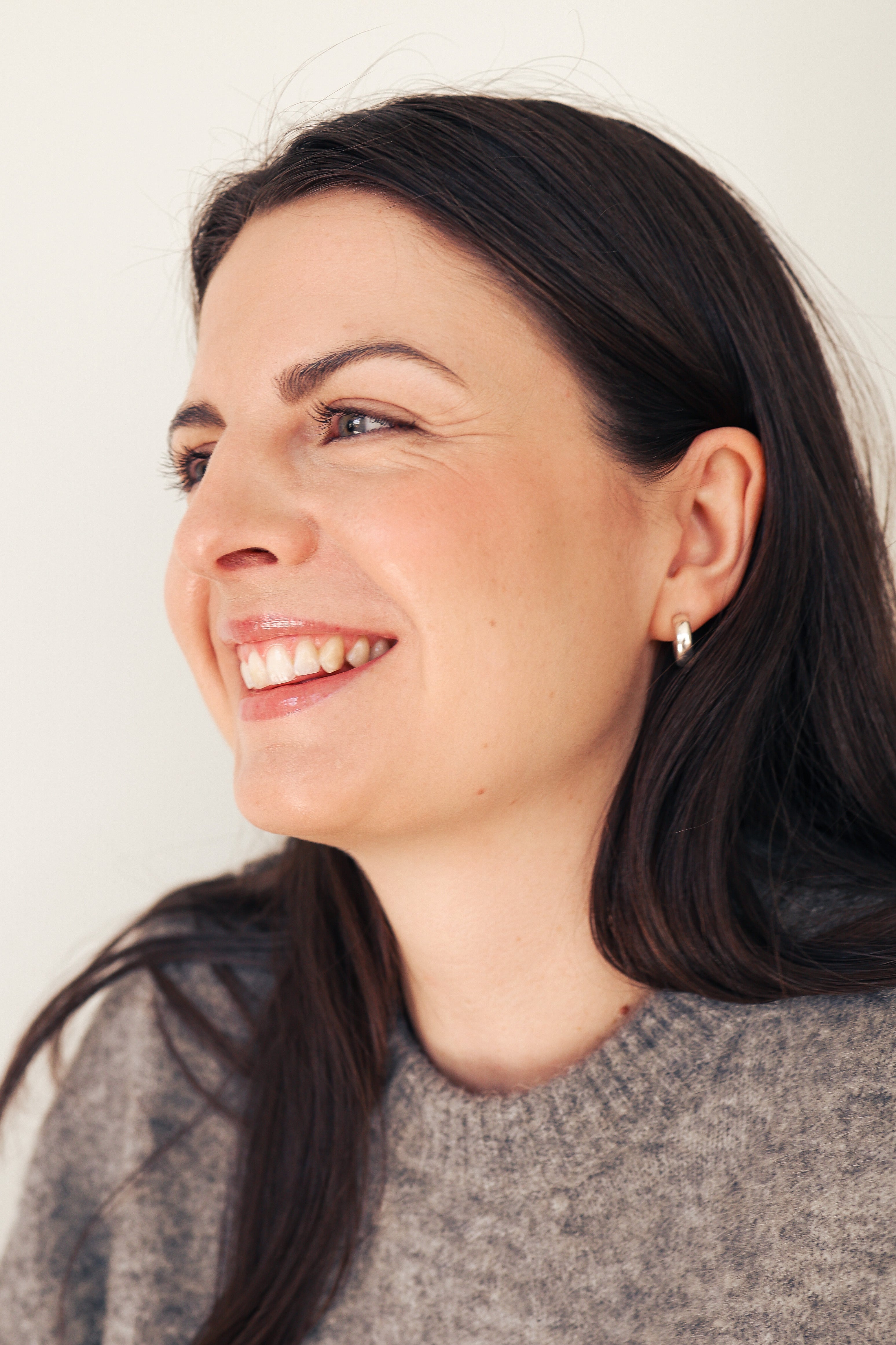 Young woman with beautiful smile looking to the side 