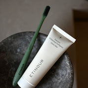 Etinour Essential Toothbrush and Essential Whitening Toothpaste in grey marble tray